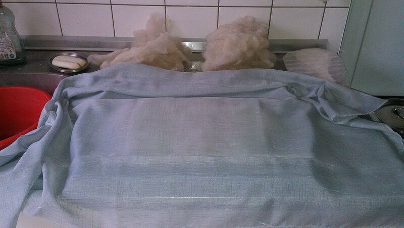 Adding a layer of sheer fabric on top.