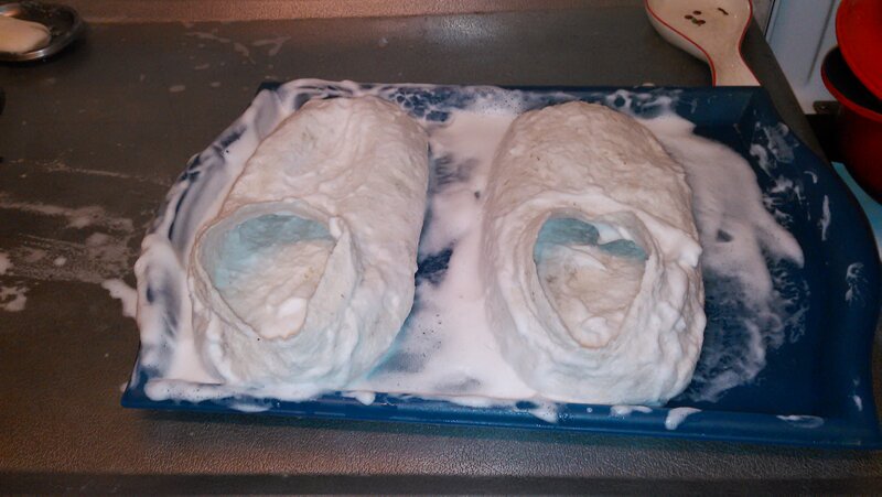 Working both slippers with soap and lots of hard rubbing and rolling